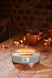 Ароматична свічка з ароматом лісу, пряної гвоздики і мускусу Woodwick Ellipse Sacred Smoke 453 г